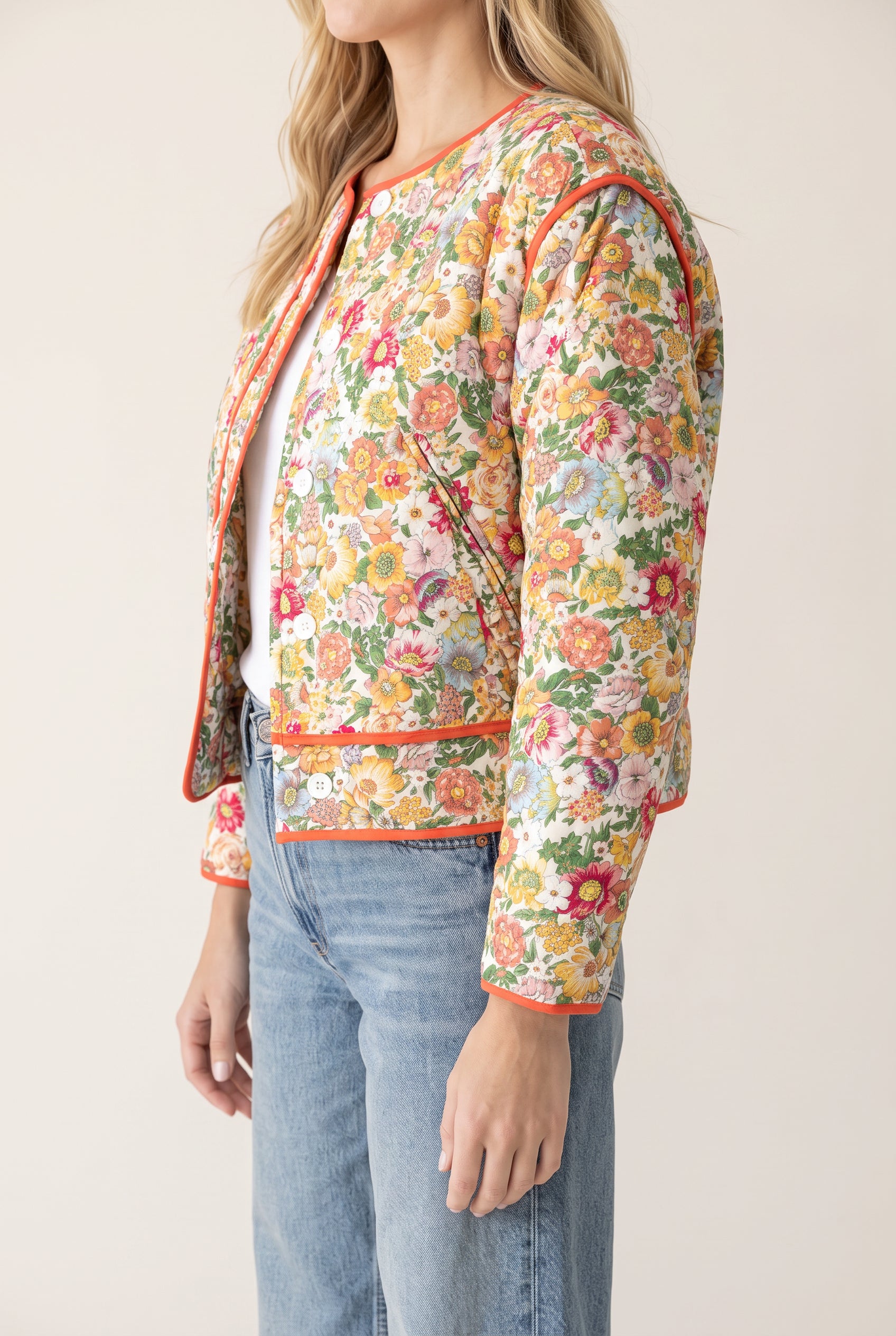 Side fit of the Small/Orange Good Feeling Cotton Jacket showing its boxy crop and sleeve shape.