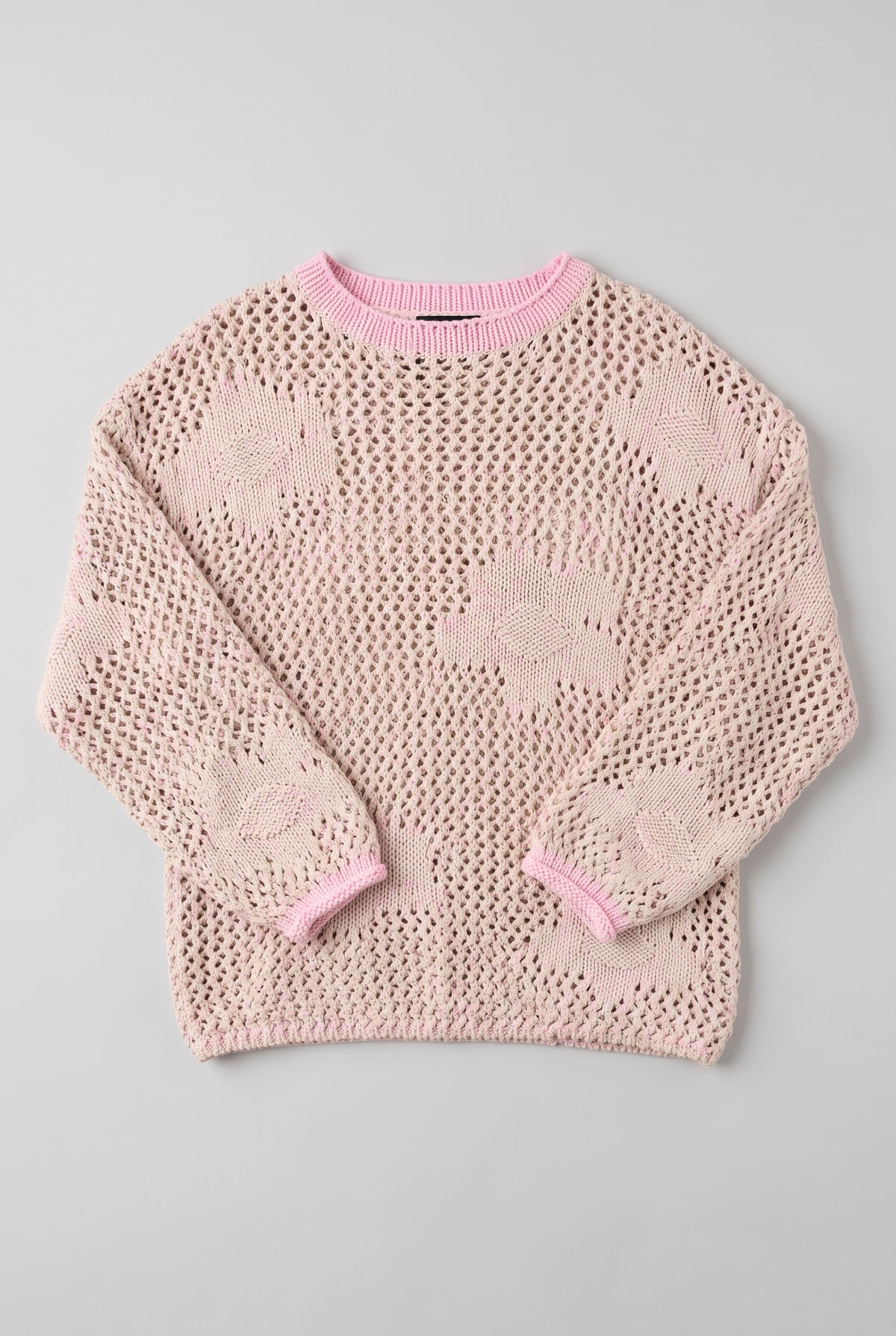 Small/Pink Flower Power Floral Sweater laid flat to show its dropped shoulders, floral motifs and relaxed shape.