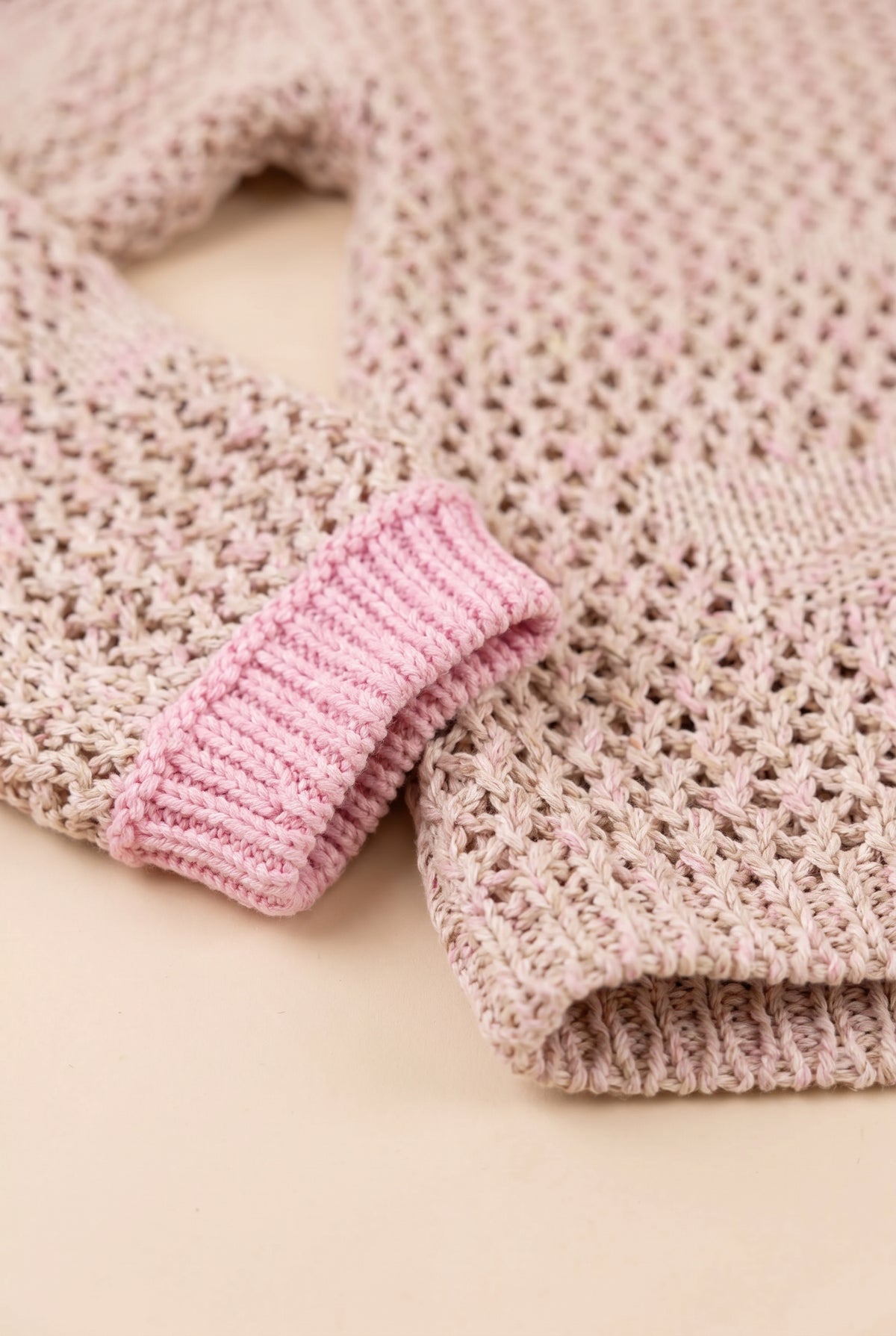 Cuff and hem detail of the Small/Pink Flower Power Floral Sweater showing its ribbed and softly finished edges.