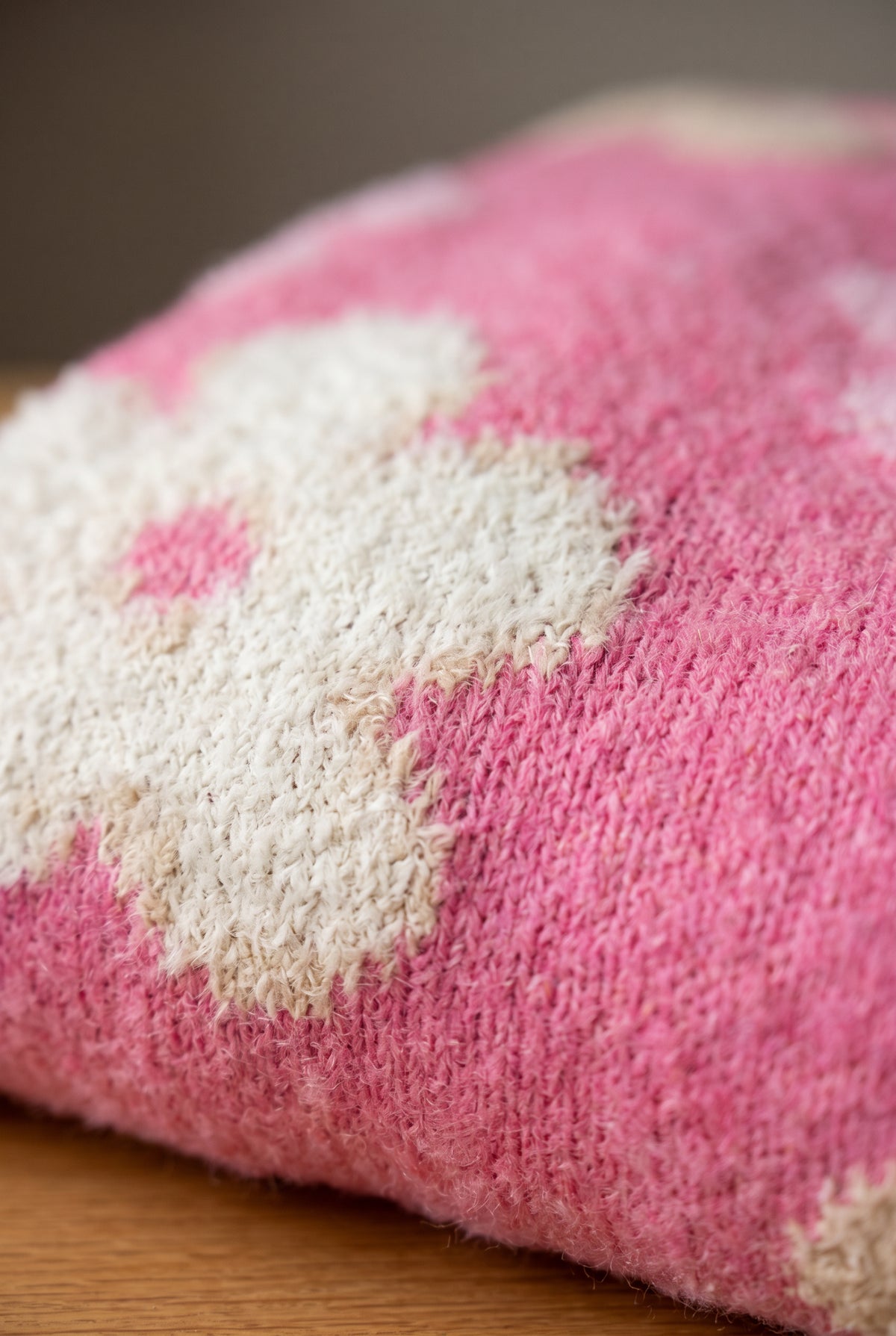 Close-up of the Everly Floral Sweater Top showing its fuzzy pink knit and oversized floral motif.