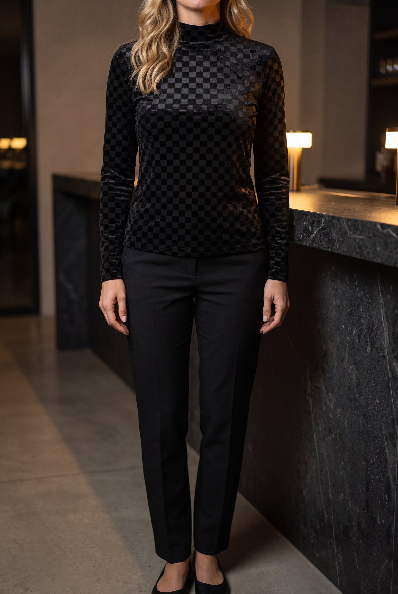 Everybody Needs Someone velvet checker top styled untucked with black trousers for a minimal night-out look.
