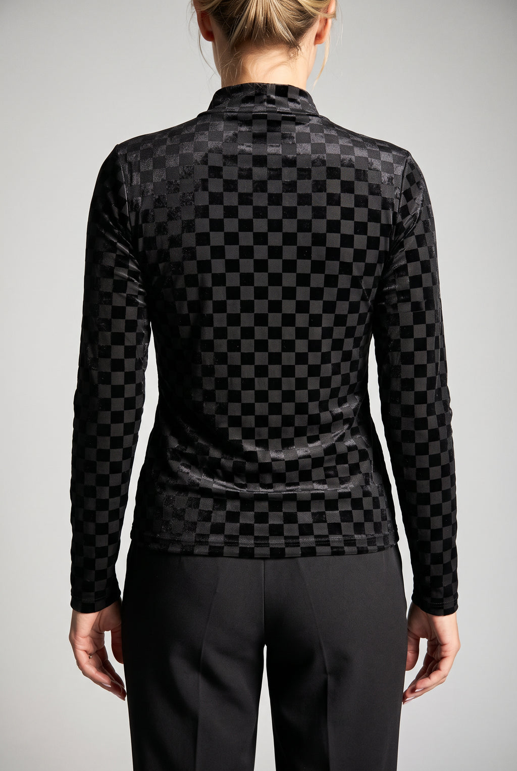 Straight back fit of the Everybody Needs Someone velvet checker top showing the mock neck and untucked hem.