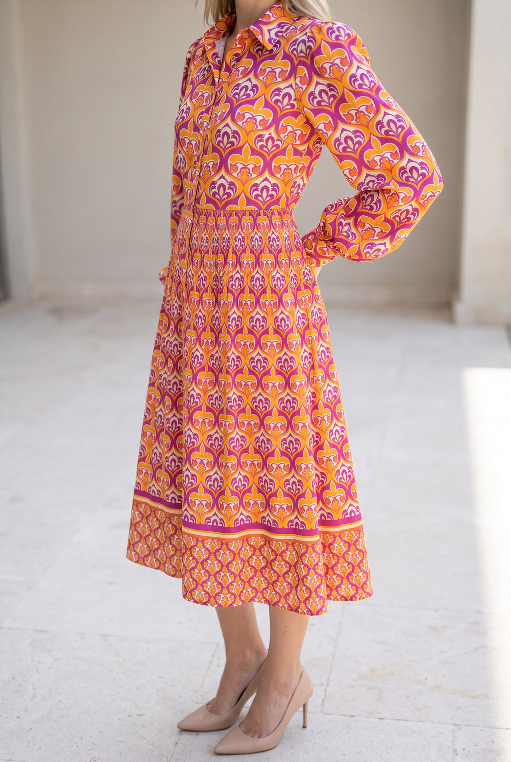 Angled side fit of the I'm Spicing Things Up Shirt Dress in Small showing the waist and skirt projection.