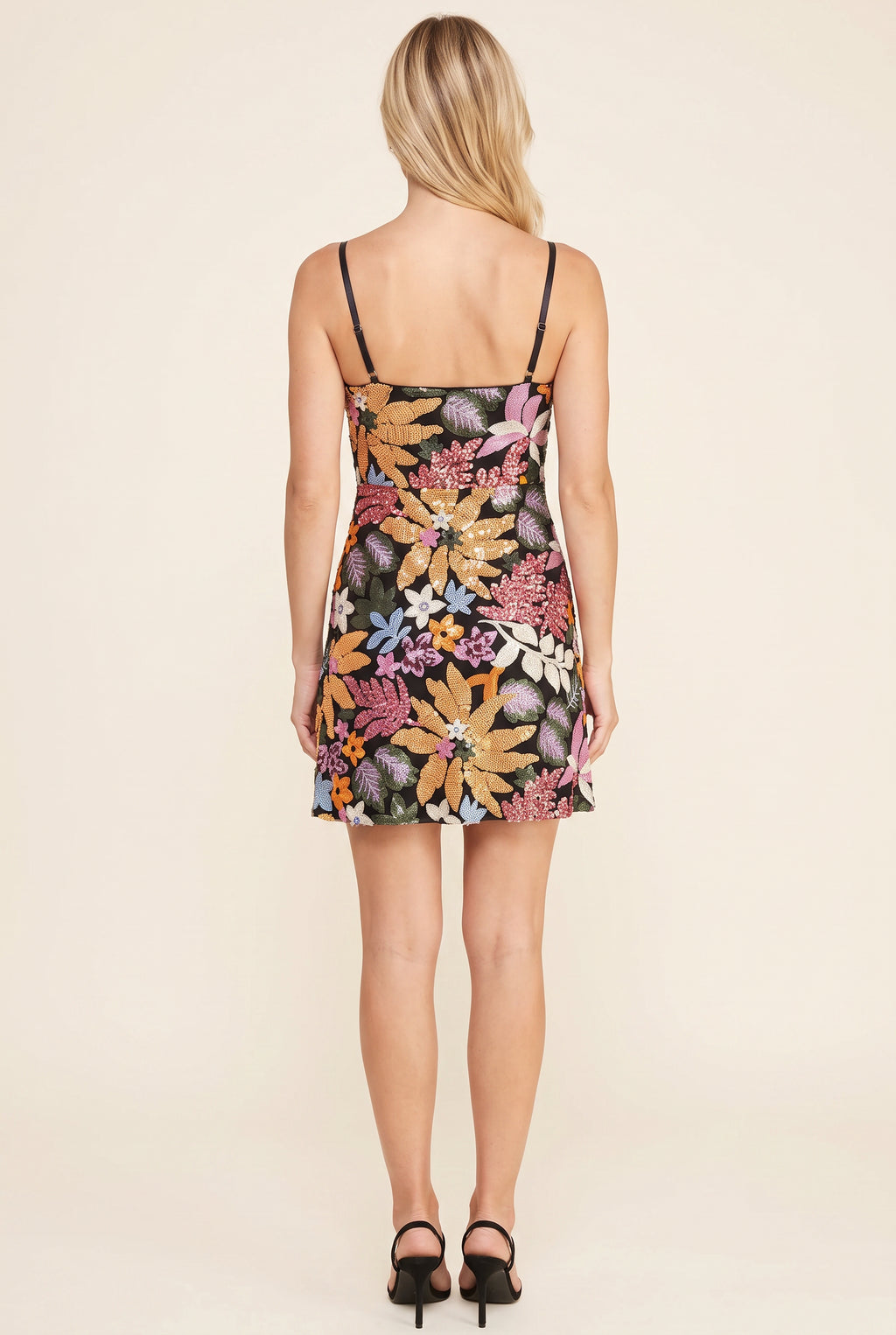 Back fit of the Floral Radiance sequin mini dress showing its low back, straps and short A-line hem.