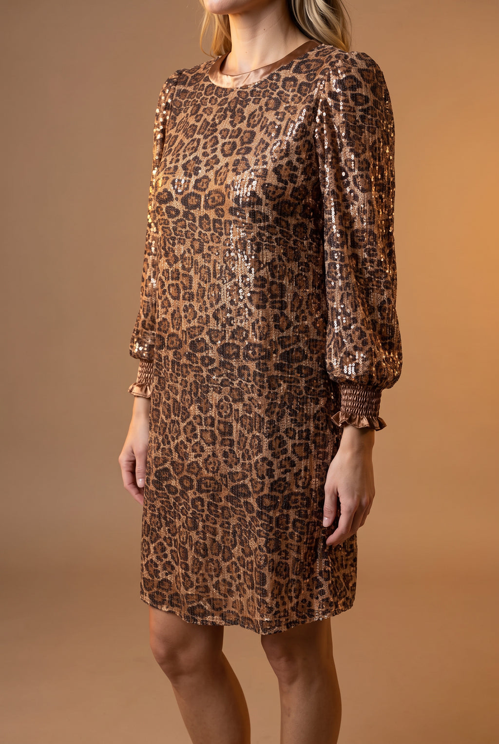 Side view of the Going Wild leopard sequin dress showing bust ease, shift depth, and mini hem.