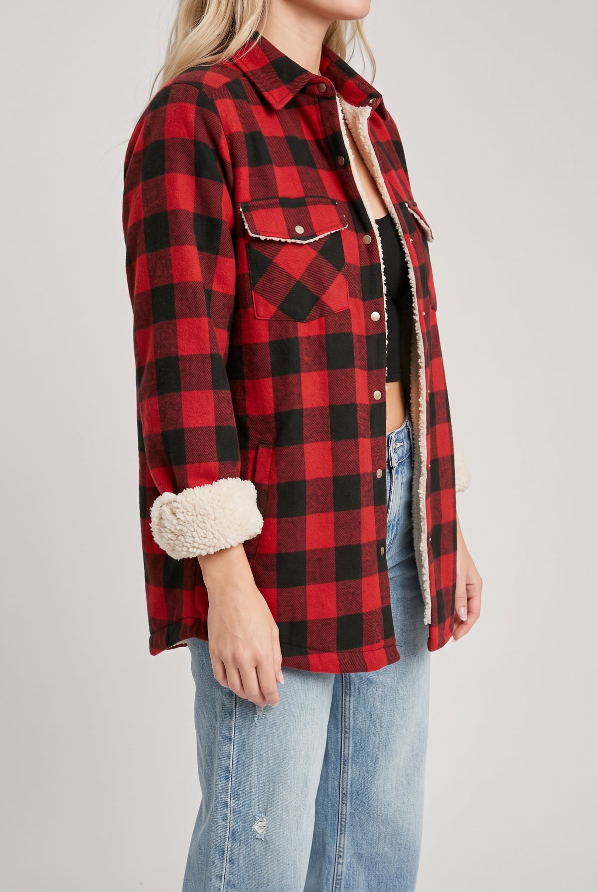 Angled side fit of the Cozy Cabin Buffalo Plaid Shacket showing its loose body and shirttail hem.