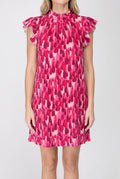 Front view of the pink pleated velvet shift dress showing its loose fit, flutter sleeves and mini length.
