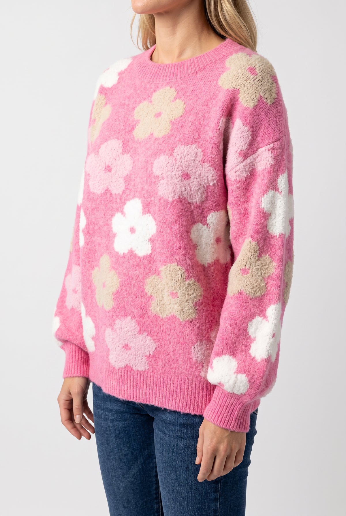 Angled side fit of the Everly Floral Sweater Top in Pink, size Small, showing its untucked upper-hip length.