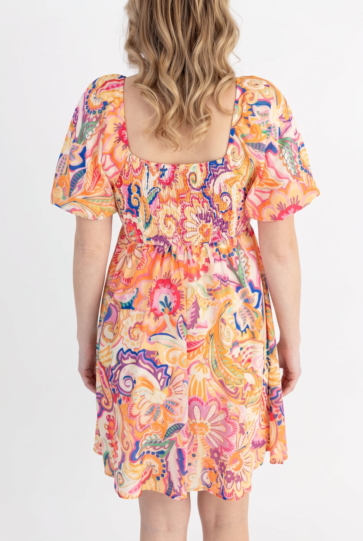 Back fit of the Create Your Sunshine Mini Dress in Small, showing the square neckline and smocked bodice.