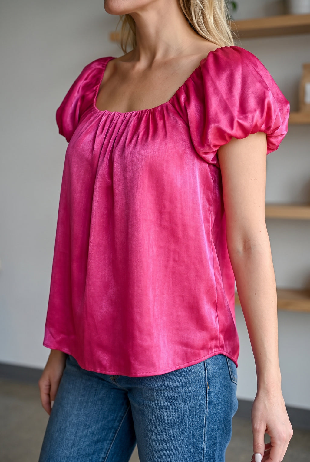 Angled fit of the Magenta puff sleeve satin top in Small, showing sleeve volume and relaxed side drape.