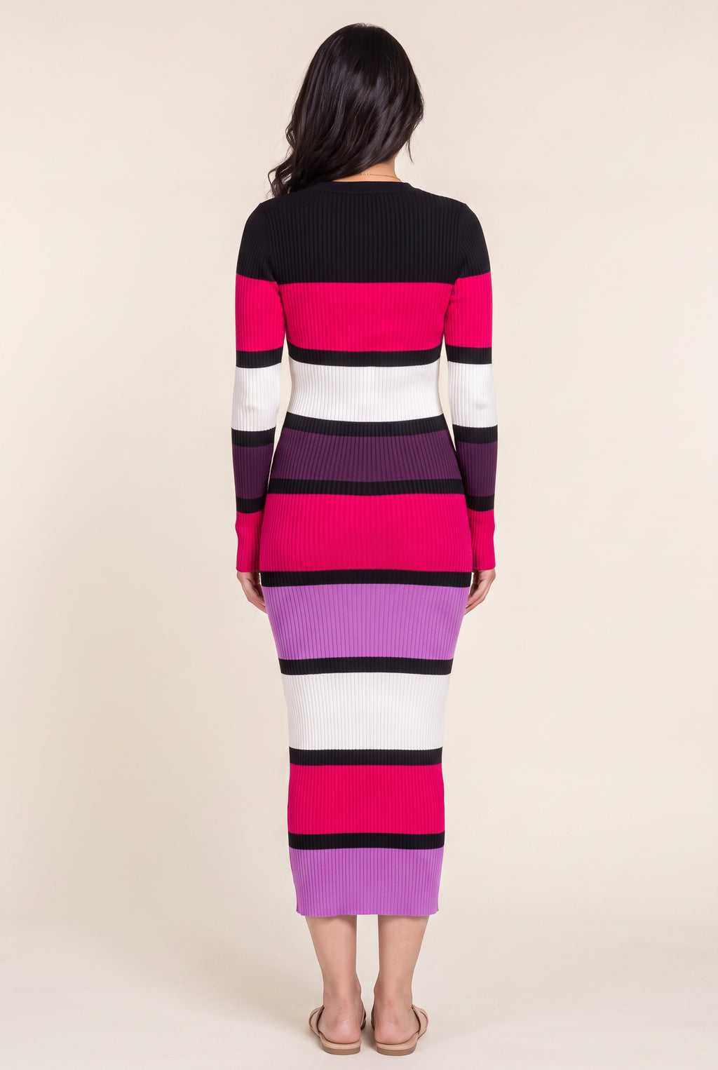Back fit of the color-block sweater dress in Small showing continuous stripes and the straight skirt.