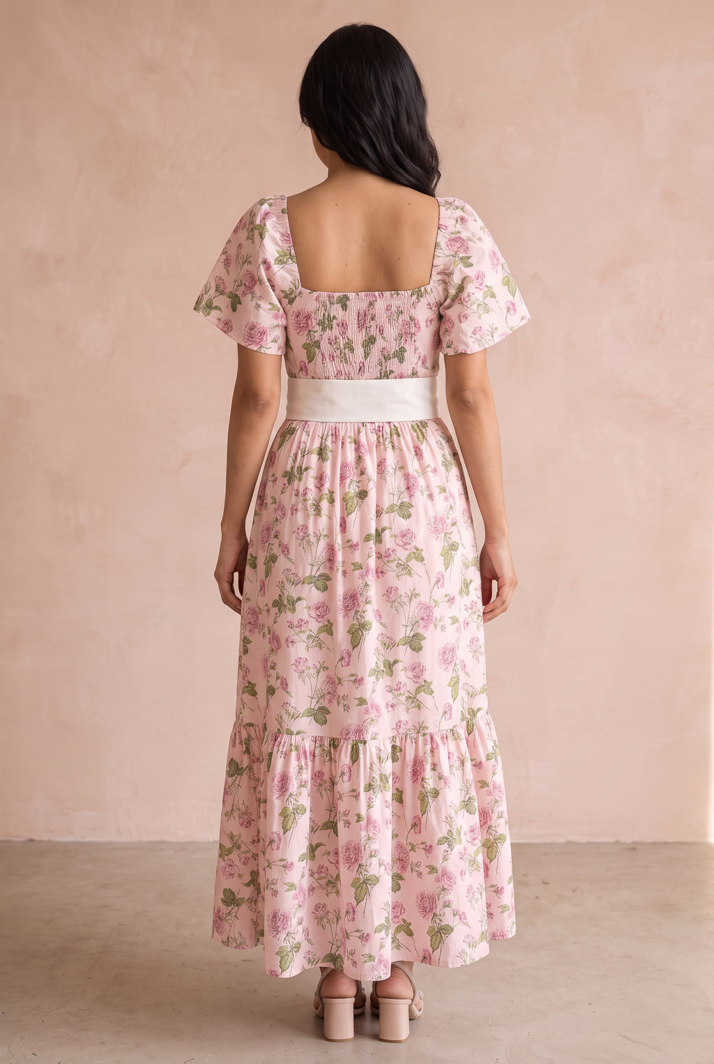 Back fit of the Small pink floral dress showing its square neckline and shirred bodice panel.