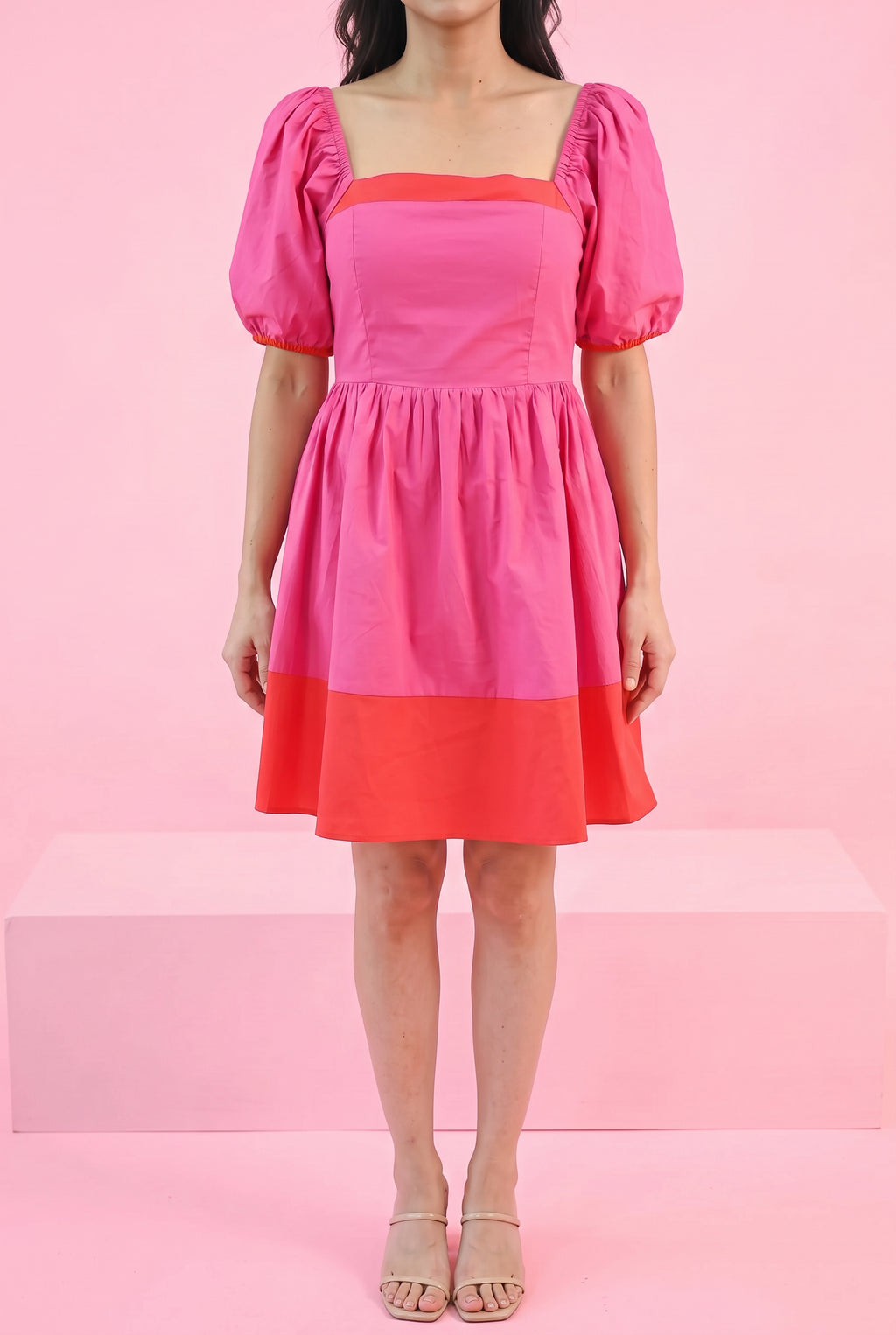 Small Magenta color block dress styled on Shweta in a minimal bright pink party setting.