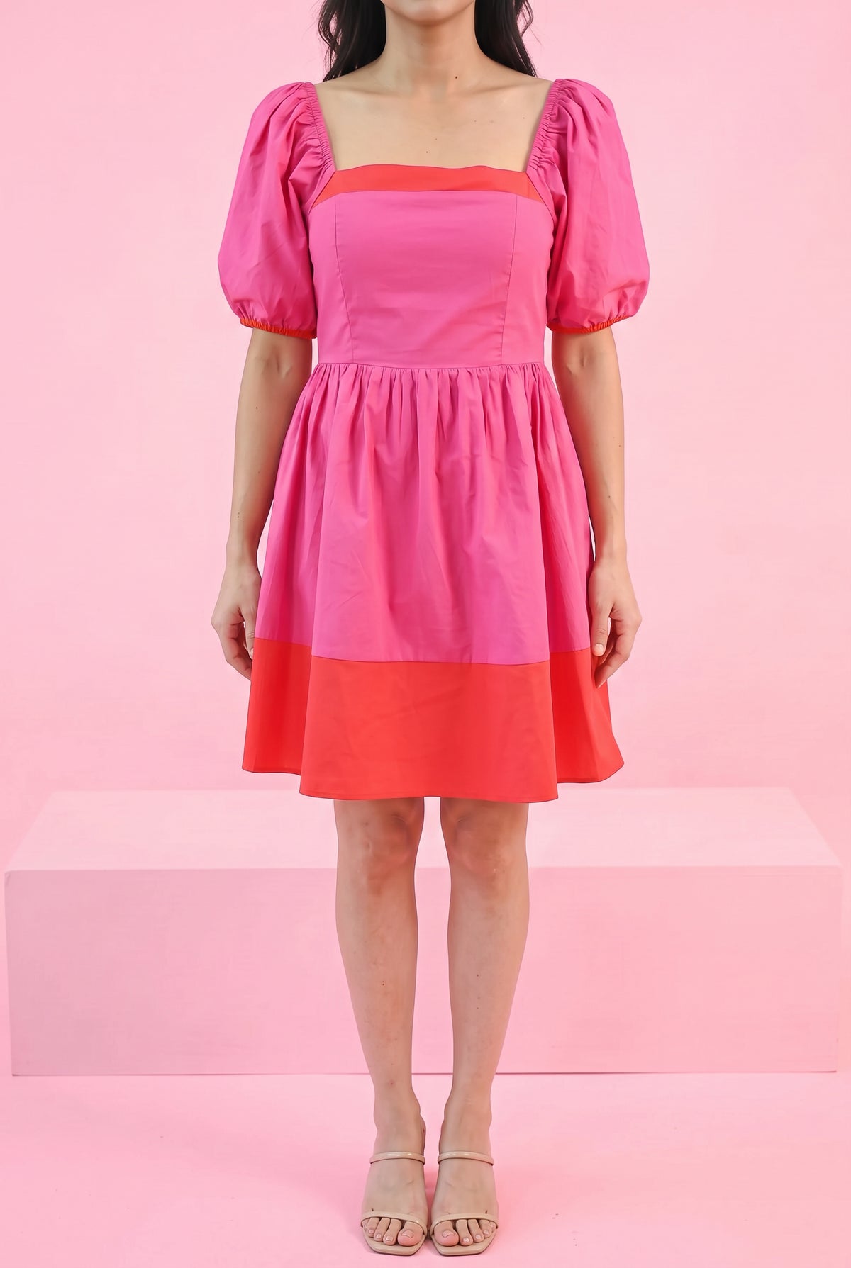 Small Magenta color block dress styled on Shweta in a minimal bright pink party setting.