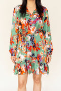 Shweta wearing the Small Green ruffled high-waist mini dress from the front.