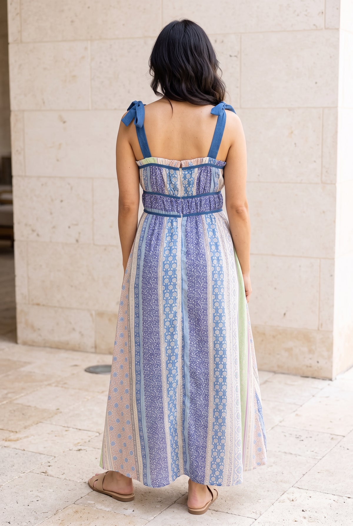Back view of the Feeling The Sunshine Maxi Dress showing its low square back, shoulder ties and center zipper.