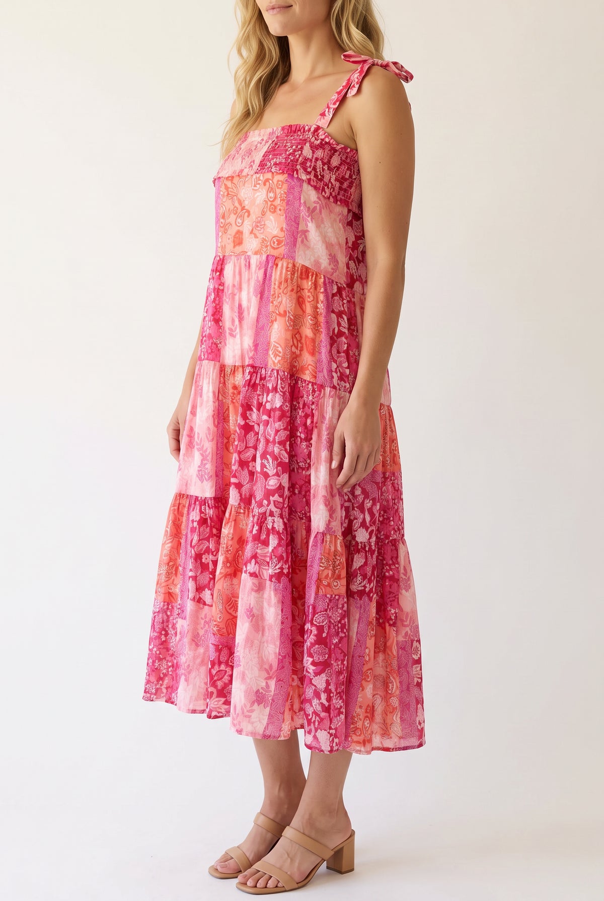 Angled side fit of the pink patchwork shoulder-tie midi dress in size Small