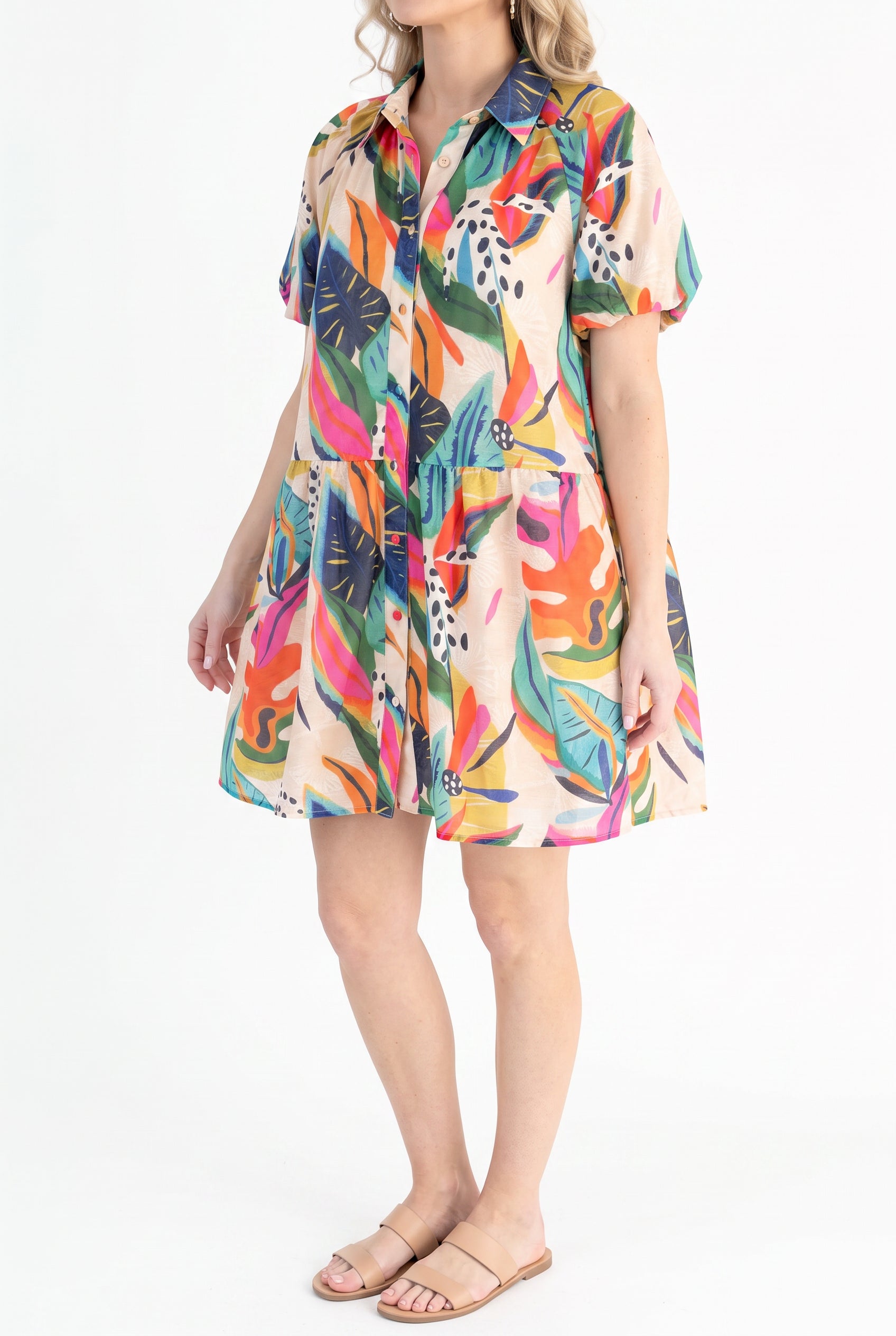 Angled side fit of the Sunset Swing shirt dress showing its puff sleeve, loose bodice and flared mini skirt.
