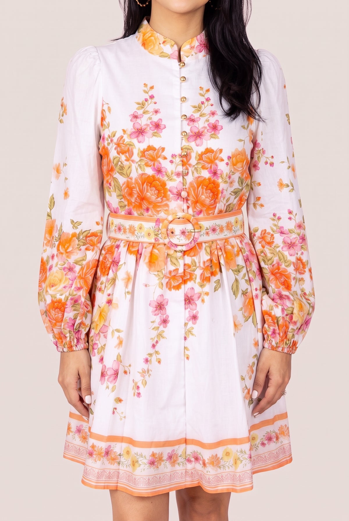 Sweet Sunshine floral mini dress in Small showing the mock neck, puff sleeves and belted front fit.