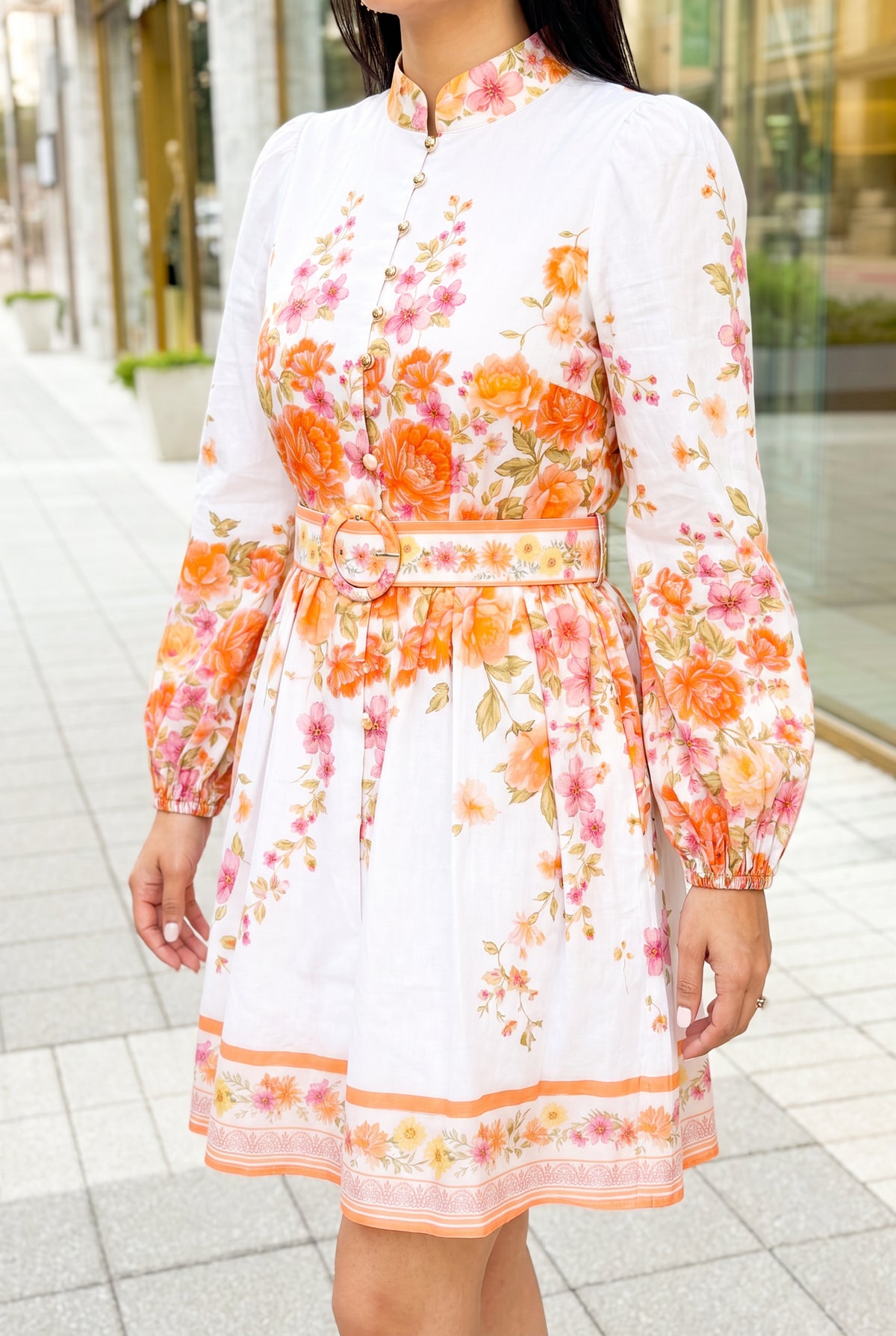 Angled side fit of the Sweet Sunshine floral mini dress showing sleeve volume and mini hem length.