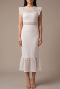 Front fit of the Dancing Flowers white lace midi dress in Small, showing its fitted shape and flounced hem.