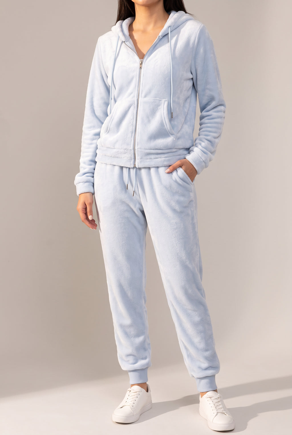 Angled side fit of the light blue plush hoodie and tapered jogger set in Small.