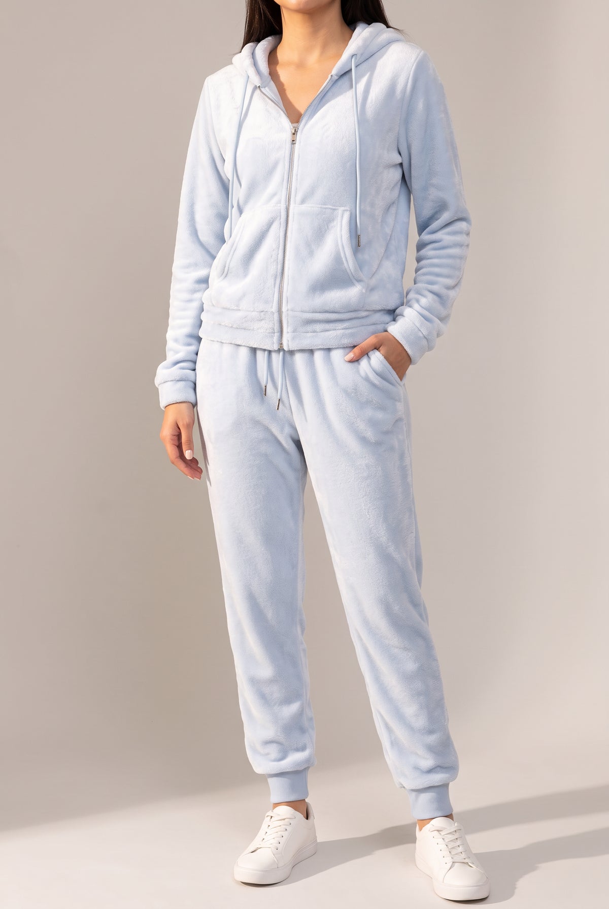 Angled side fit of the light blue plush hoodie and tapered jogger set in Small.