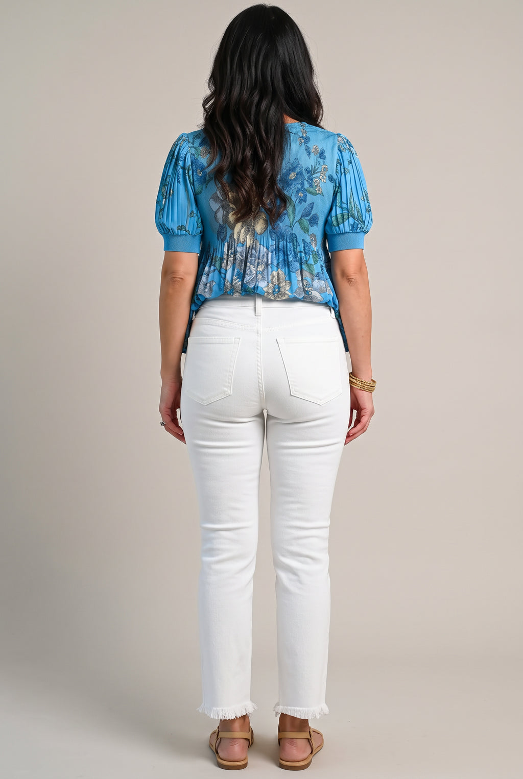 Back view of All of Me white cropped jeans showing the yoke, patch pockets, seat fit and raw hems.
