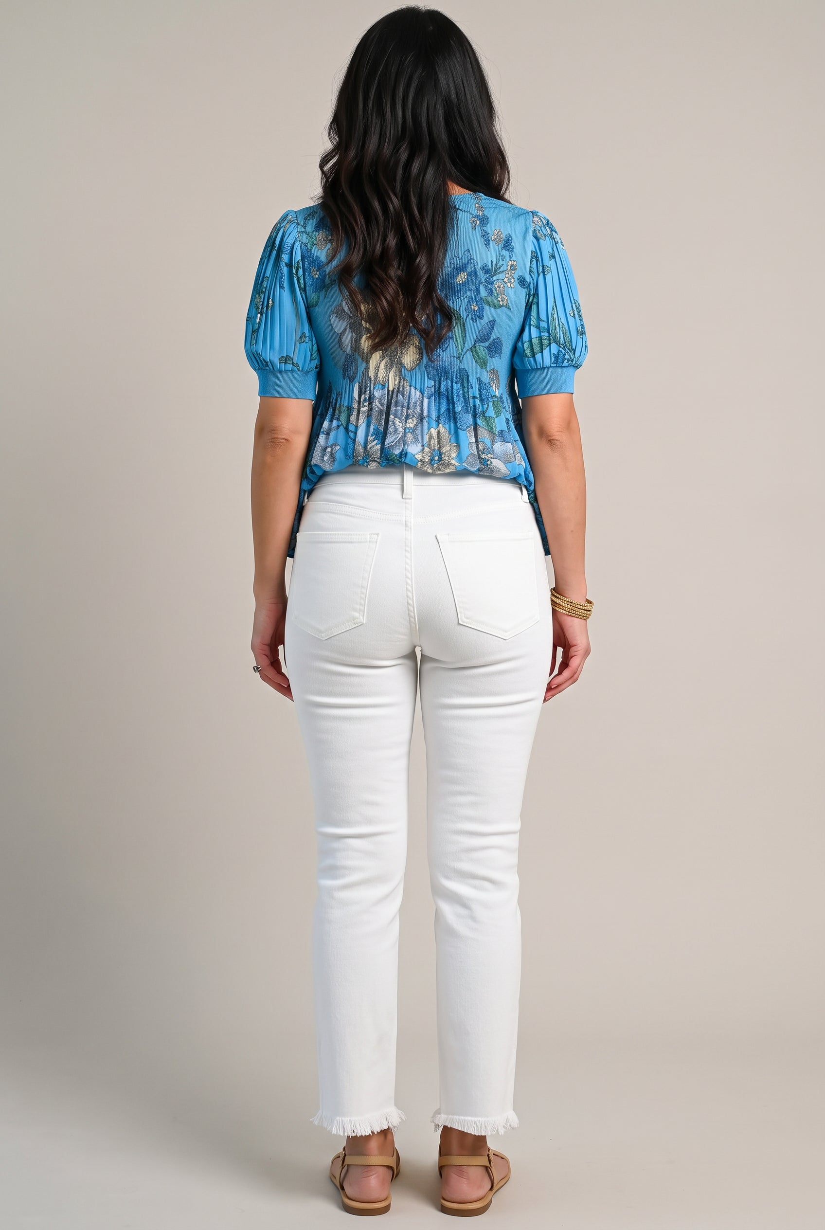 Back view of All of Me white cropped jeans showing the yoke, patch pockets, seat fit and raw hems.