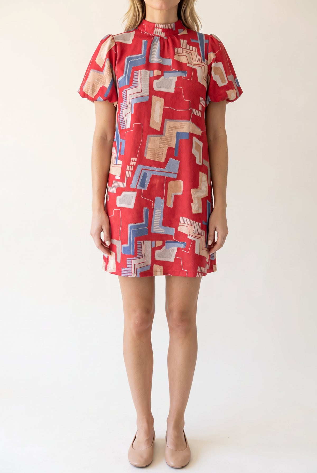 Front fit of the Bold Statement Bubble Sleeve Tie Back Dress in Small Red.