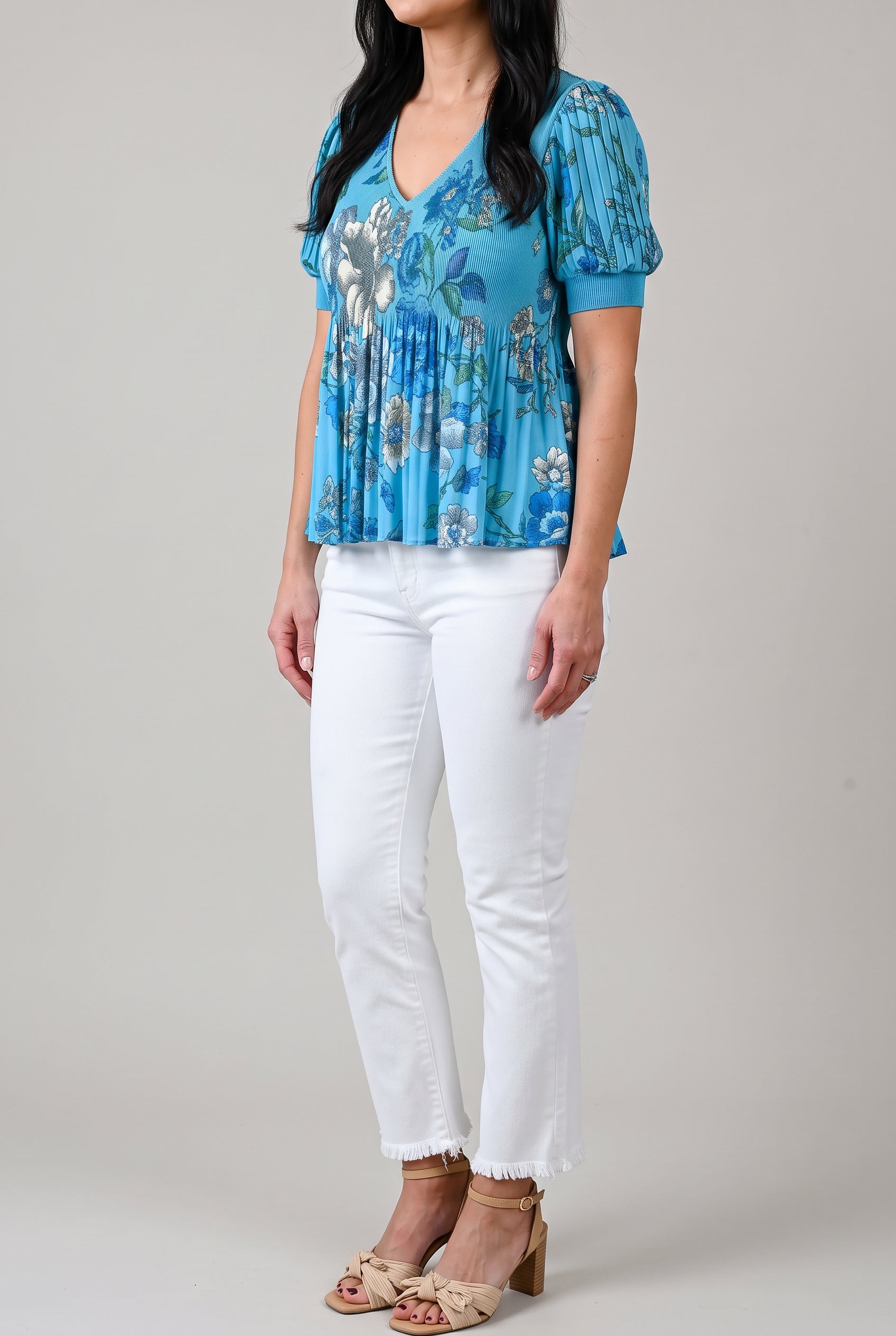 Angled side view of All of Me white cropped jeans showing the rise, hip fit and straight outer seam.