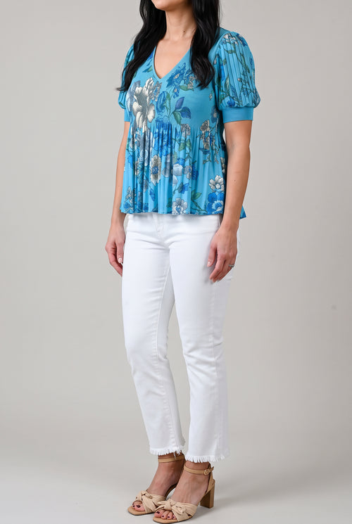 Angled side view of All of Me white cropped jeans showing the rise, hip fit and straight outer seam.