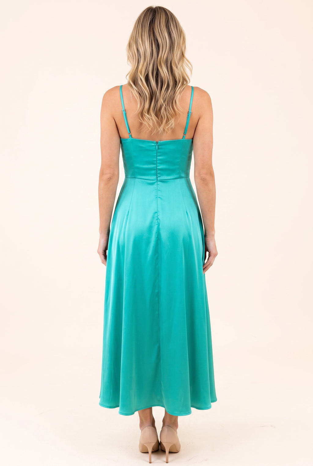 Back view of the Turquoise Bow-tiful You Midi Dress showing its straps, zipper and full skirt.