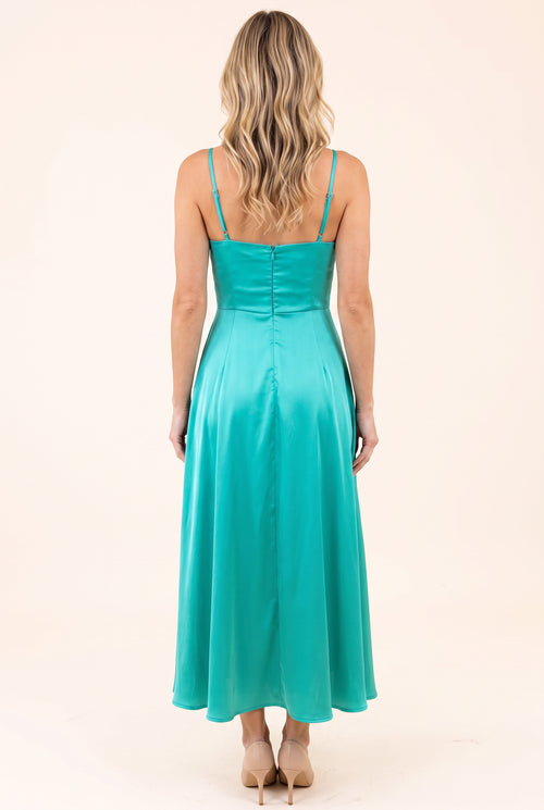 Back view of the Turquoise Bow-tiful You Midi Dress showing its straps, zipper and full skirt.
