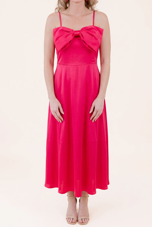 Front view of the Fuchsia Bow-tiful You Midi Dress showing the bow and full A-line length.