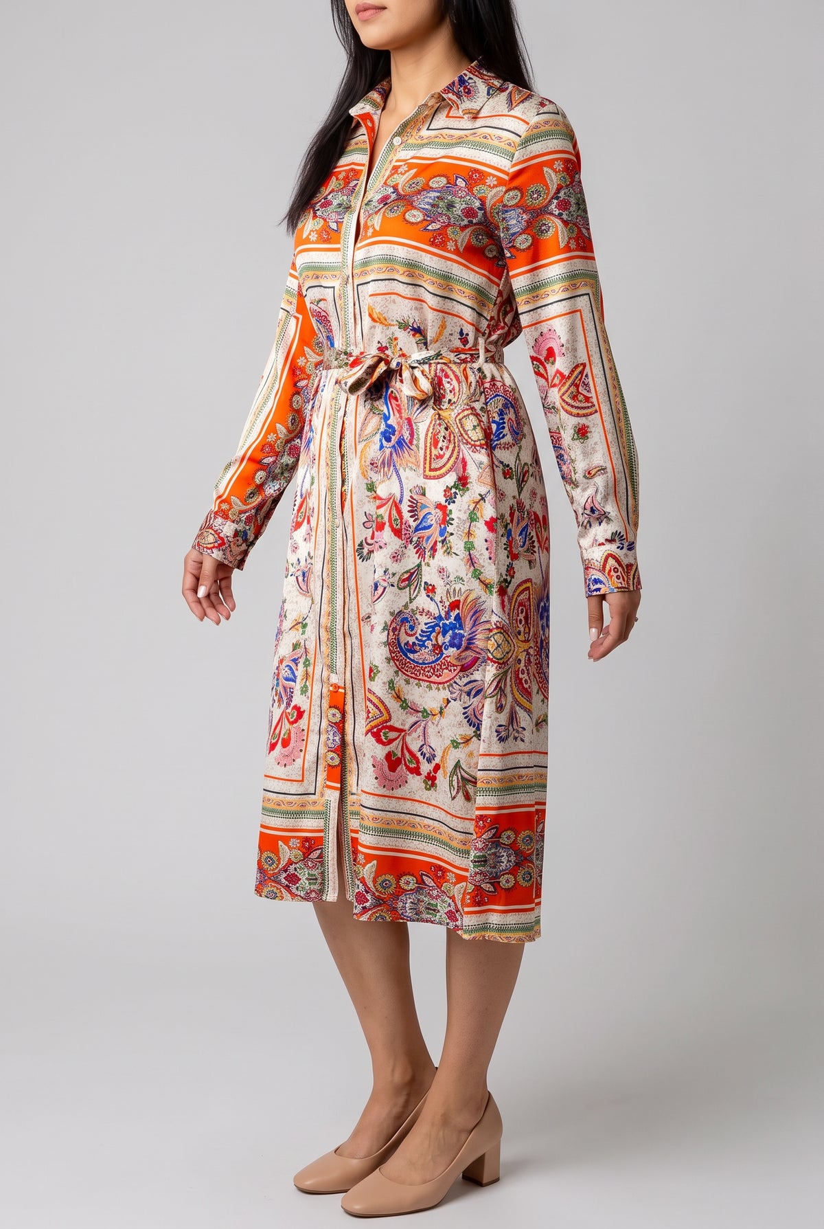 Angled side view of the scarf-print shirt dress showing sleeve ease, waist shaping, and skirt drape.