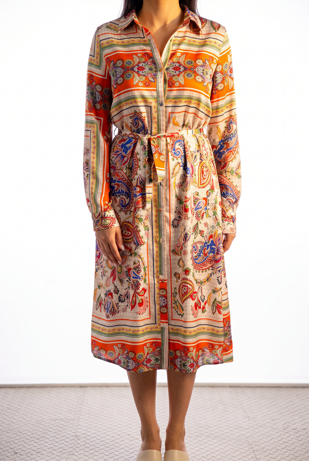 Close view of the scarf-print dress showing print scale, surface sheen, and the pale ivory skirt panel.