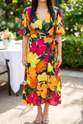 Front view of the If You're Not the One floral wrap midi dress in size Small.