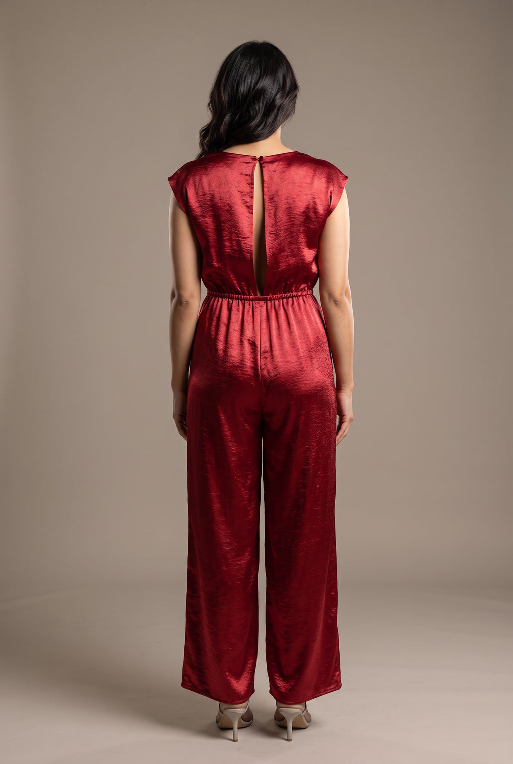 Back view of the I'm Yours red satin jumpsuit showing the long keyhole, waist and rear leg fit.
