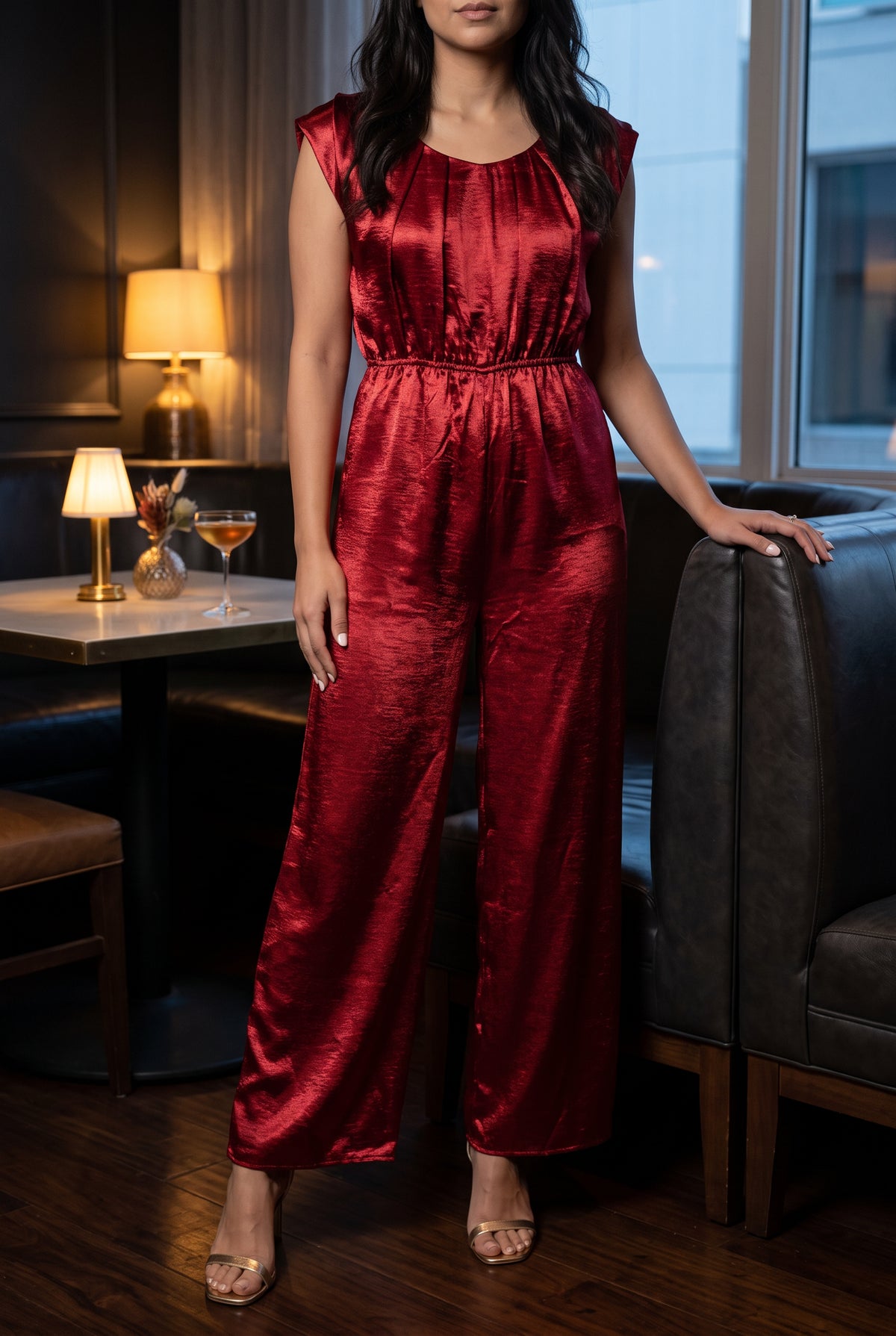 I'm Yours red satin jumpsuit styled with heels for an evening cocktail-lounge setting.