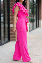 Angled side view of the Made You Look jumpsuit showing the armhole, waist, rise and wide-leg fall.