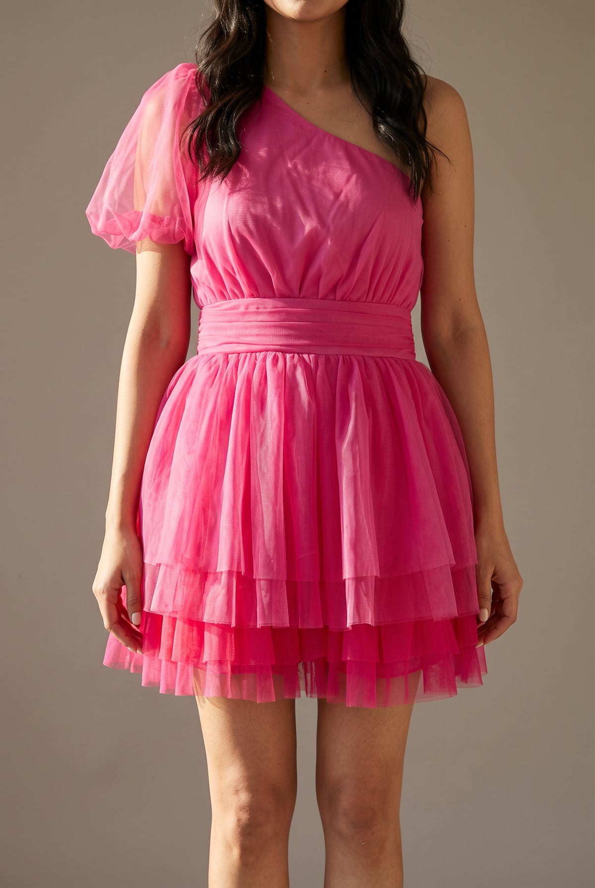 Close view of the See You Again Mini Dress showing the ruffled sleeve, asymmetric neckline and gathered waistband.