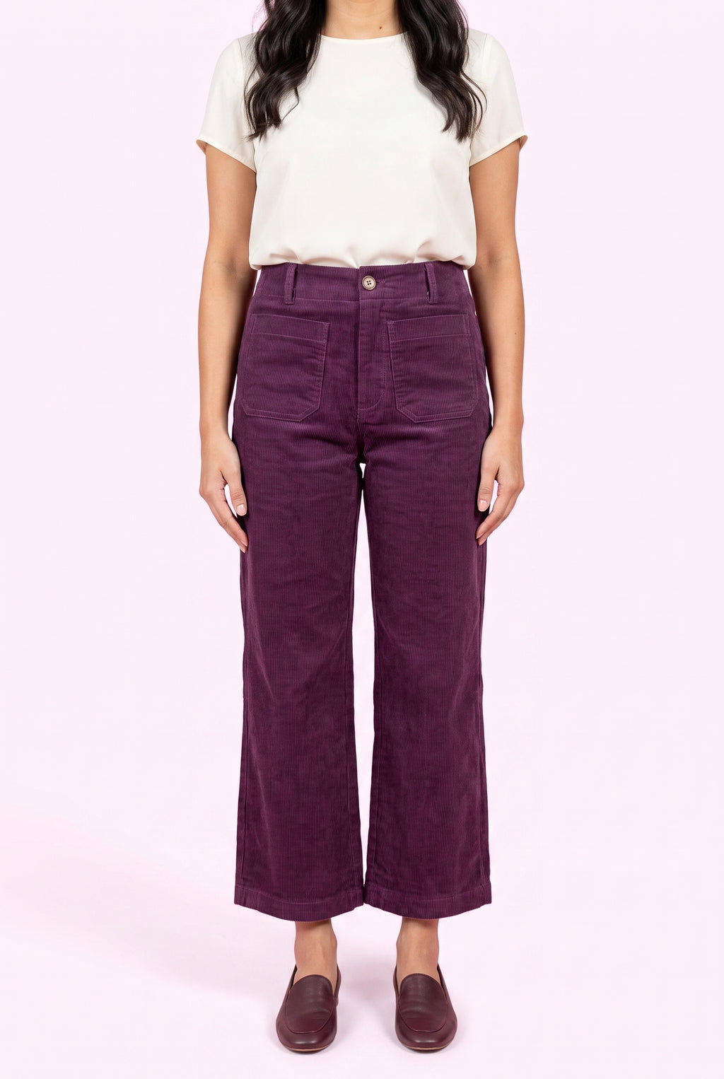Front fit of Rollin' With You purple corduroy pants showing the high rise, pockets, and cropped wide legs.