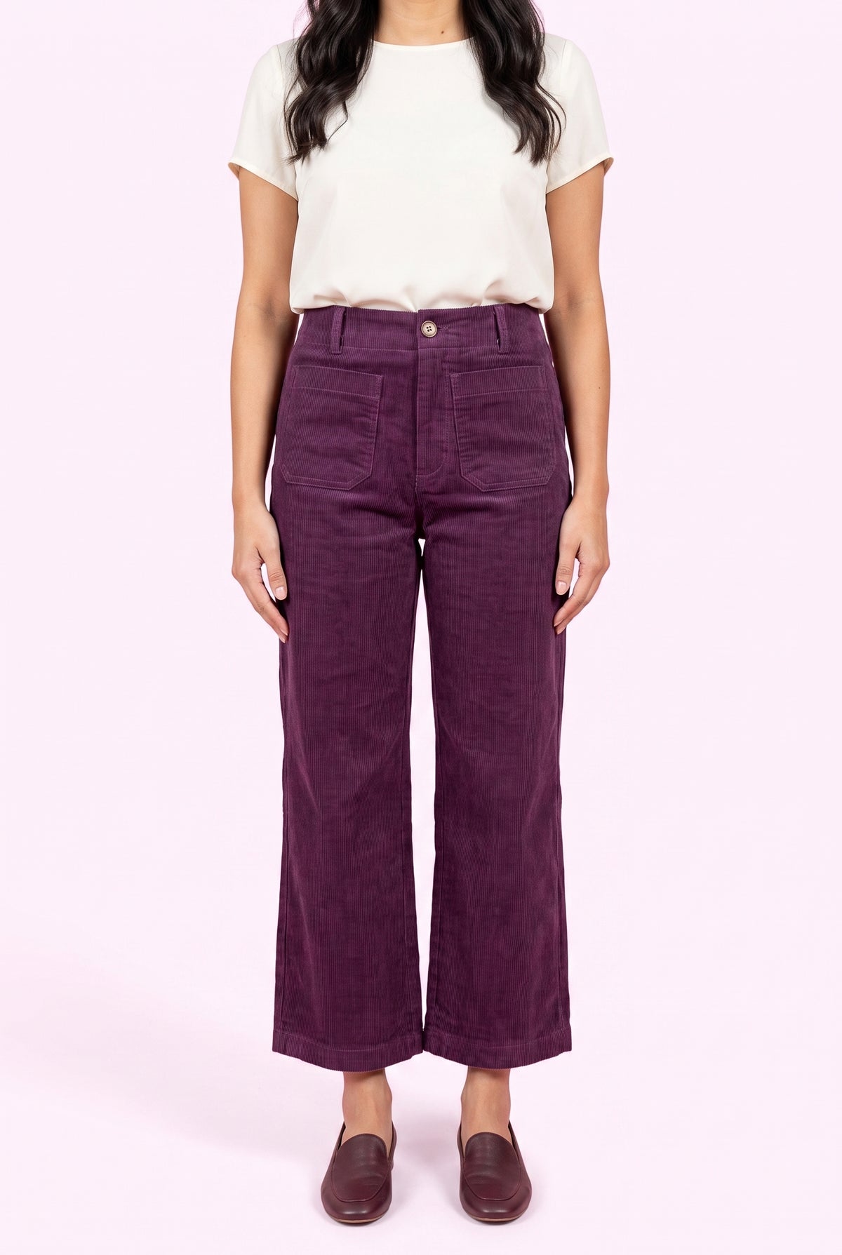 Front fit of Rollin' With You purple corduroy pants showing the high rise, pockets, and cropped wide legs.