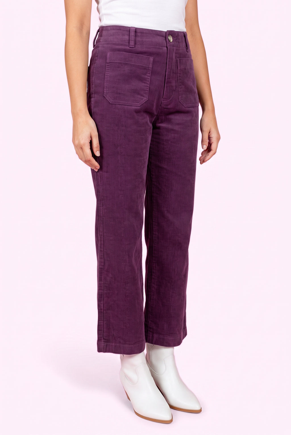 Angled side fit of Rollin' With You purple corduroy pants showing the high rise and cropped wide-leg profile.