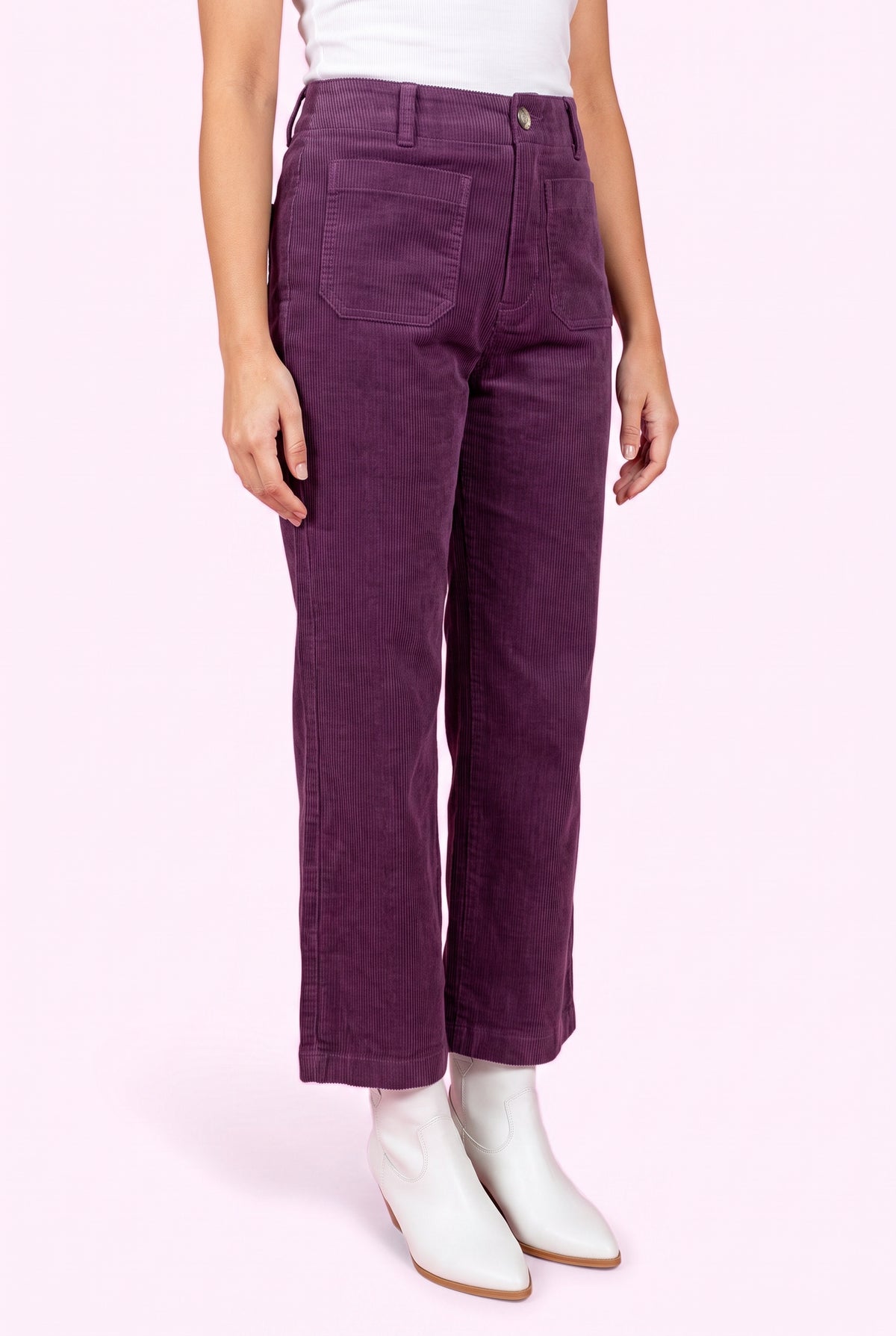Angled side fit of Rollin' With You purple corduroy pants showing the high rise and cropped wide-leg profile.
