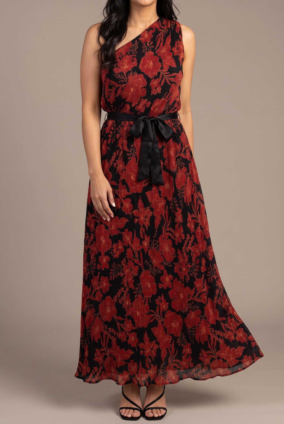 Front fit of the floral pleated one-shoulder maxi dress in Small with black sash and full hem.