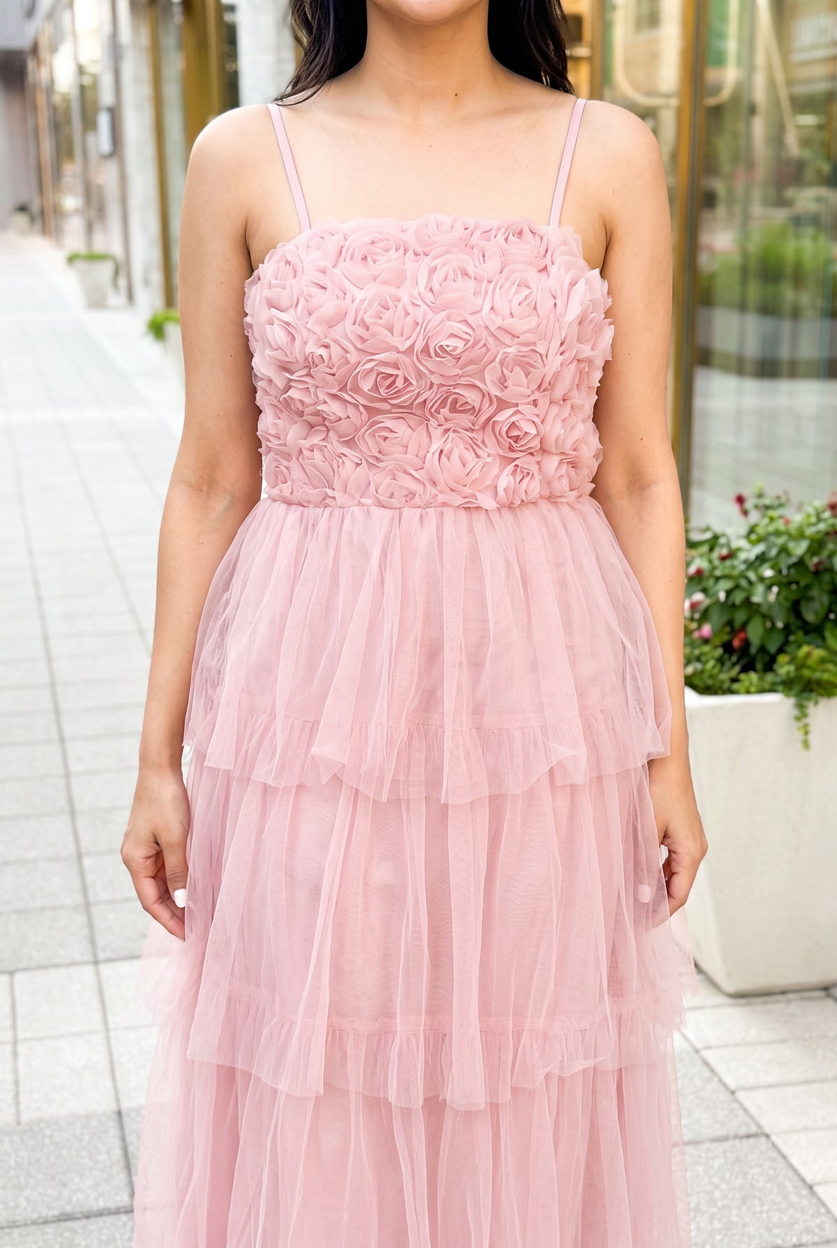 Close detail of the Kiss From a Rose Midi Dress showing its straps, rose bodice and layered pink tulle.