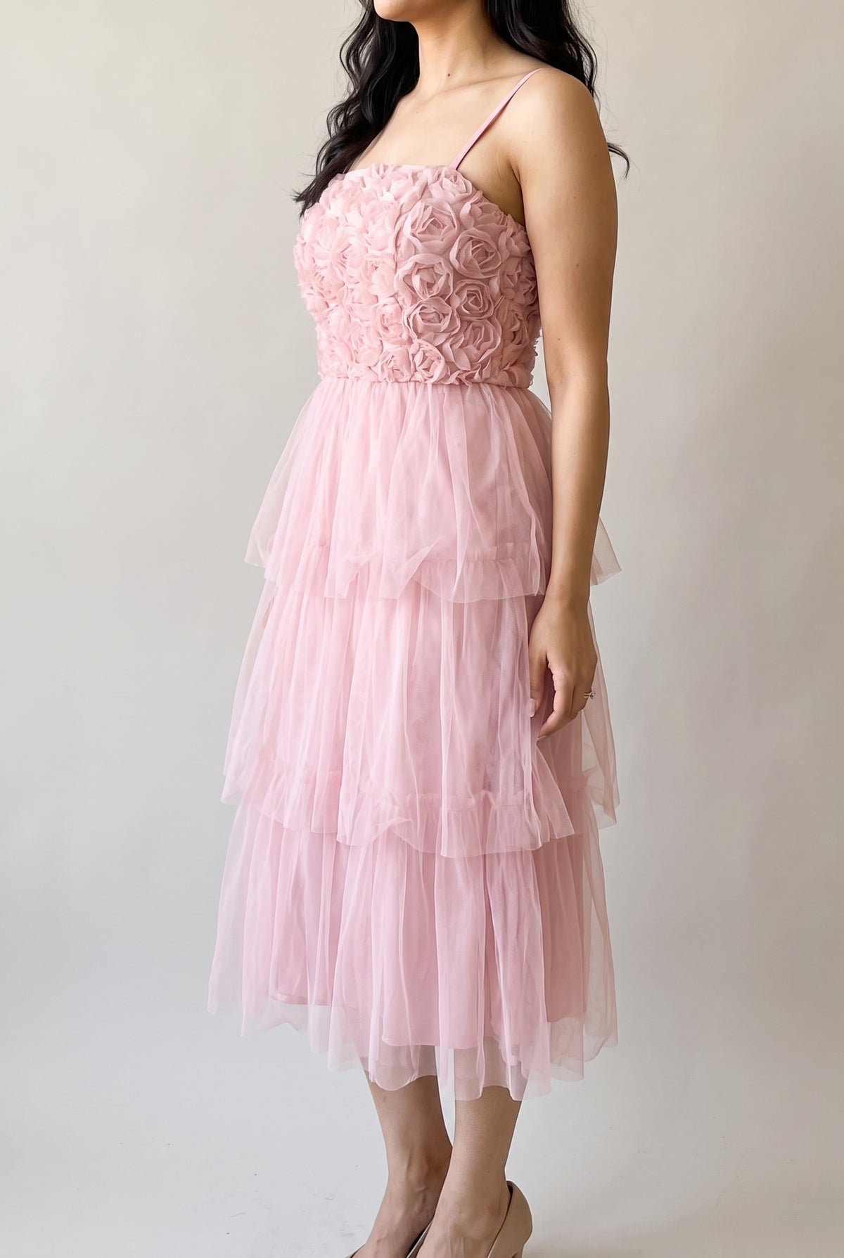 Angled side view of the Kiss From a Rose Midi Dress showing bodice fit, skirt depth and midi length.