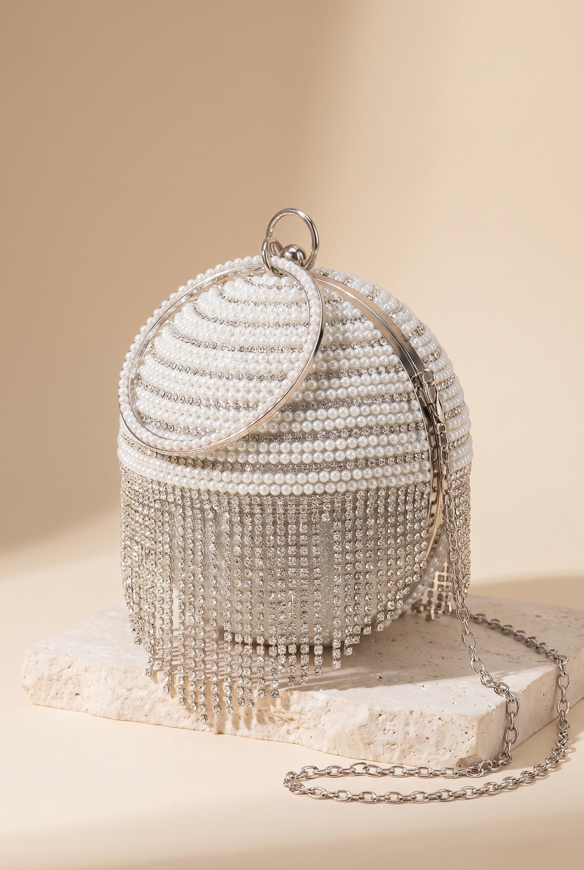 The Lola pearl rhinestone fringe ball bag on its own, showing its shape.